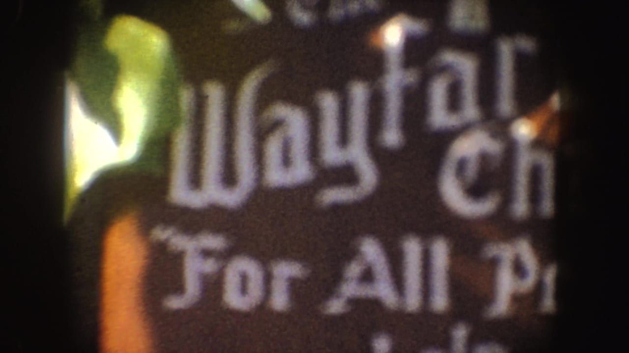 Another blurred sign close-up with Wayfarer and For All People text partly visible.