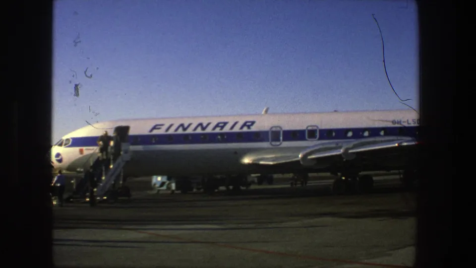 Side view of the Finnair aircraft at Stockholm Arlanda with stairs at the door and ground equipment below the fuselage.