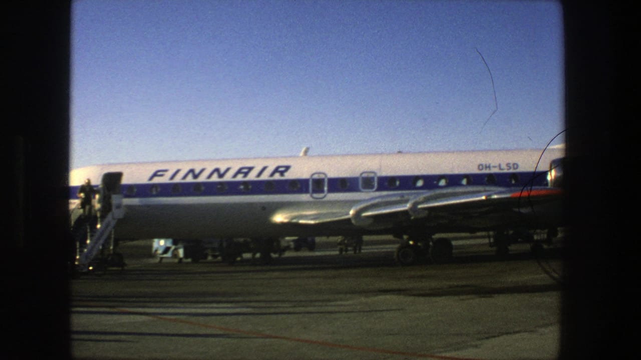 1975 Stockholm airport footage showing a Finnair Super Constellation on the tarmac with blue-and-white livery and boarding stairs nearby.
