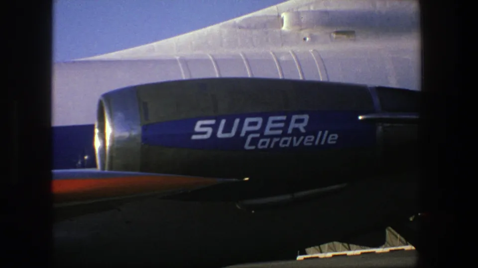 Close 8mm view of the Finnair Super Caravelle engine area, with the blue Super Caravelle lettering visible beneath the rear fuselage.