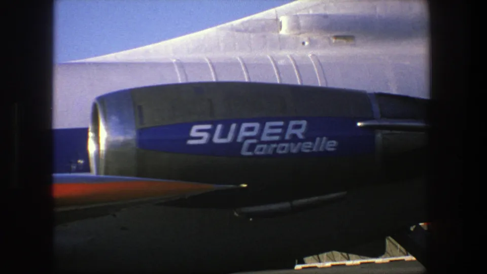 Close-up detail of the Super Caravelle lettering on the Finnair aircraft, showing the engine housing and rear fuselage in bright daylight.