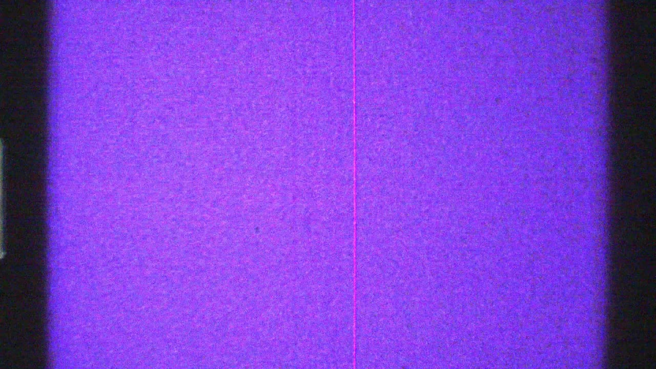 Purple screen texture with central dark band, edge shadows, and faint scratches.