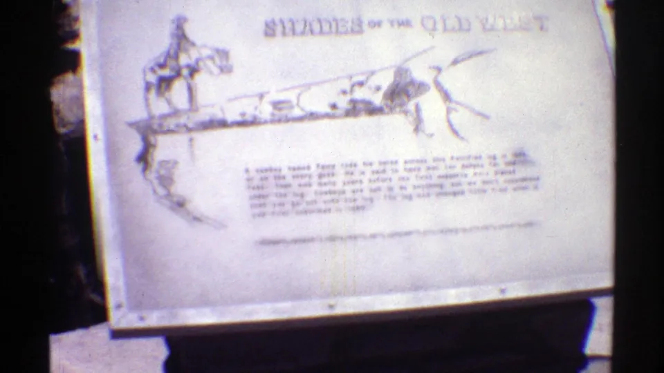 1969 Arizona 8mm frame centered on the "Shades of the Old West" tourist sign with artwork and explanatory text.