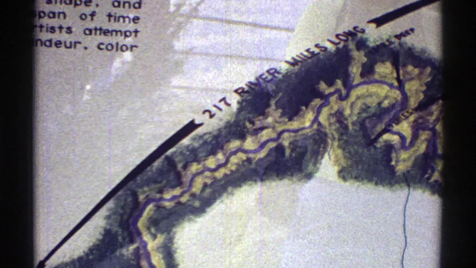 1969 Arizona 8mm frame showing the Grand Canyon map detail with a visible 217-mile river label and cropped sign text.