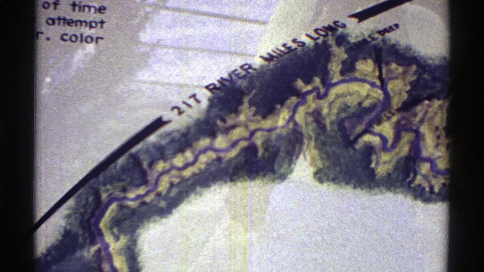1969 Arizona 8mm frame showing a tilted hand-drawn river map with topographical shading and a “217 RIVER MILES LONG” label.