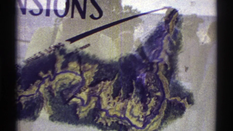 1969 Arizona 8mm frame showing a closer map section with large partial lettering, shaded terrain, and a dark vertical frame border.
