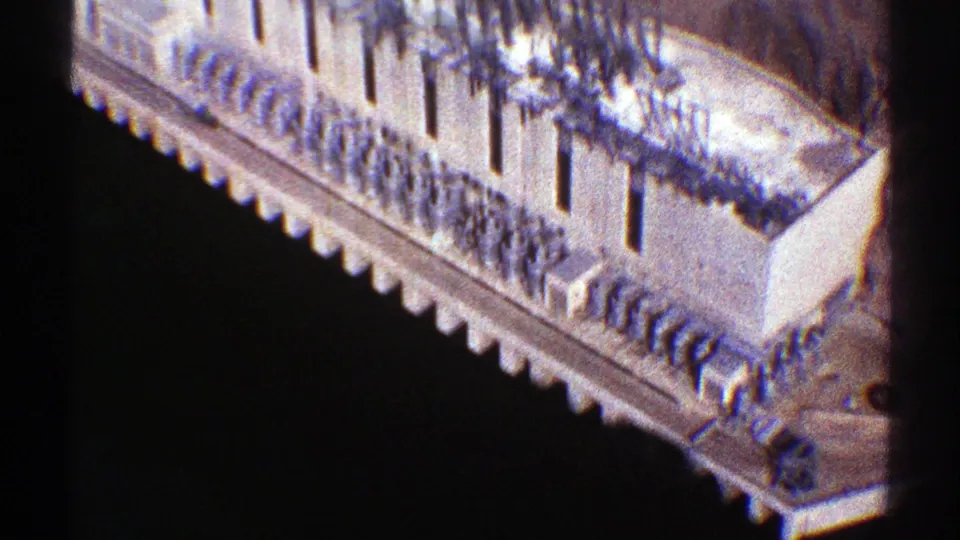 1969 Arizona 8mm frame with a closer view of the building's stepped railings, pale walls, and dark drop below.