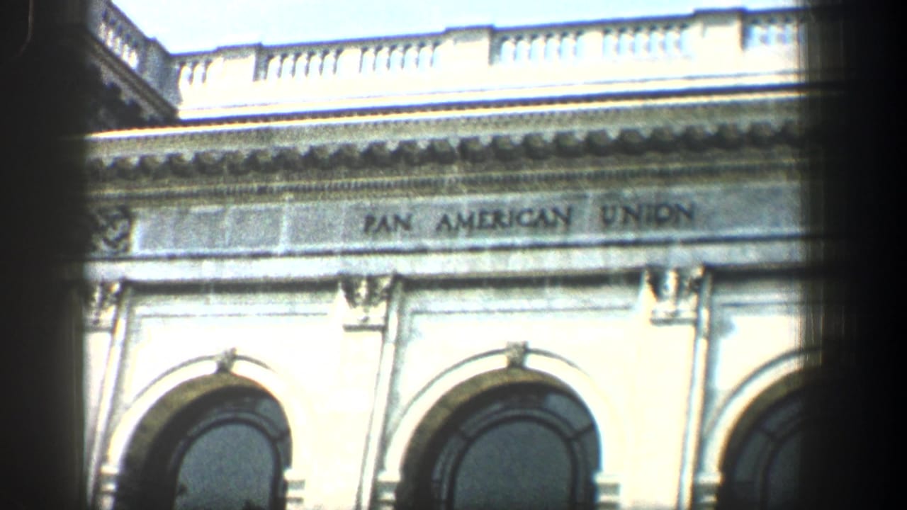 Upper facade with Pan American Union inscription and arched windows.