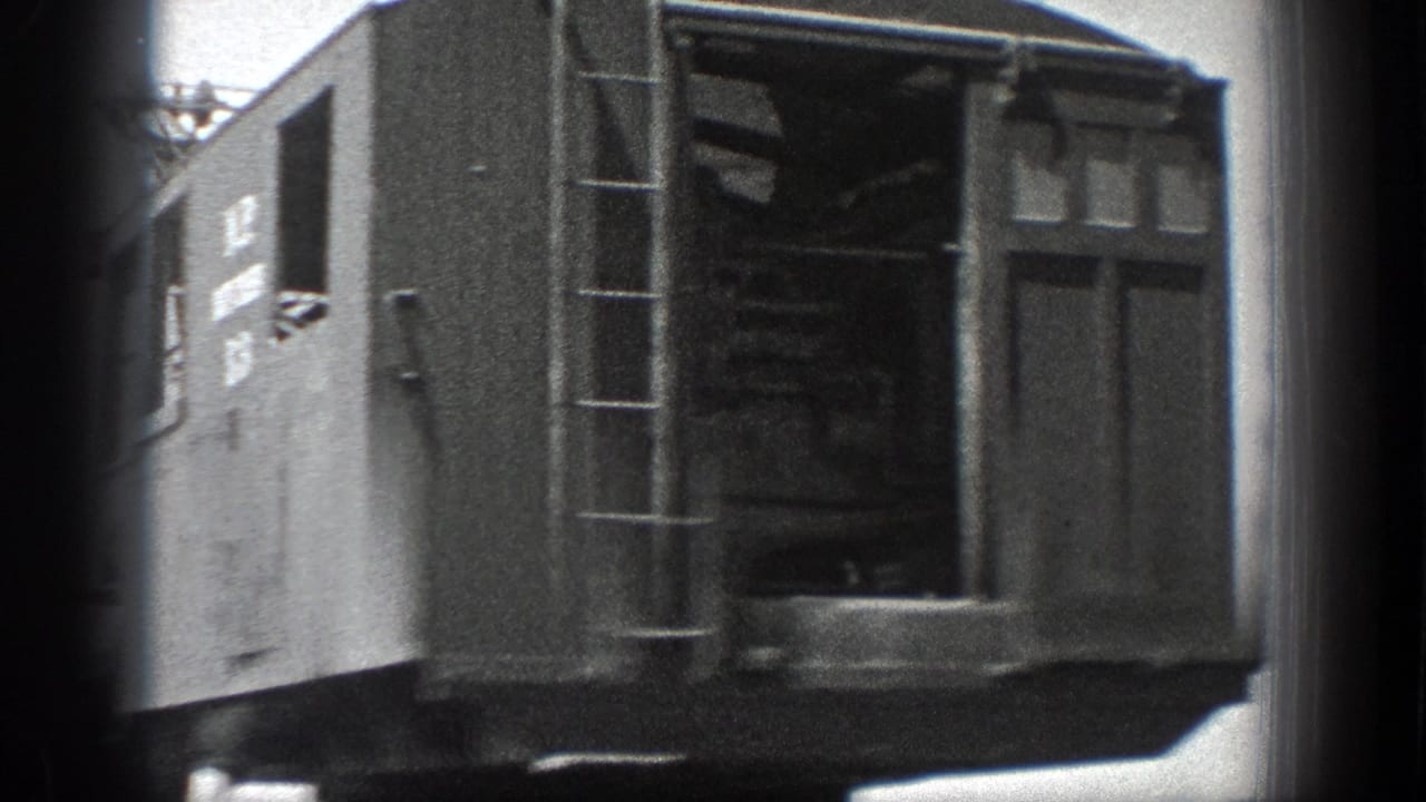 1936 California 8mm frame showing a large crane cab with a side ladder, paneled body, and open operator area.