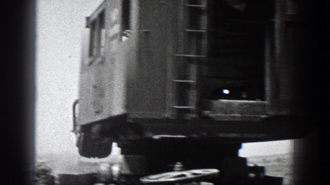 Rear underside of the crane cab with ladder and wheel assembly visible.