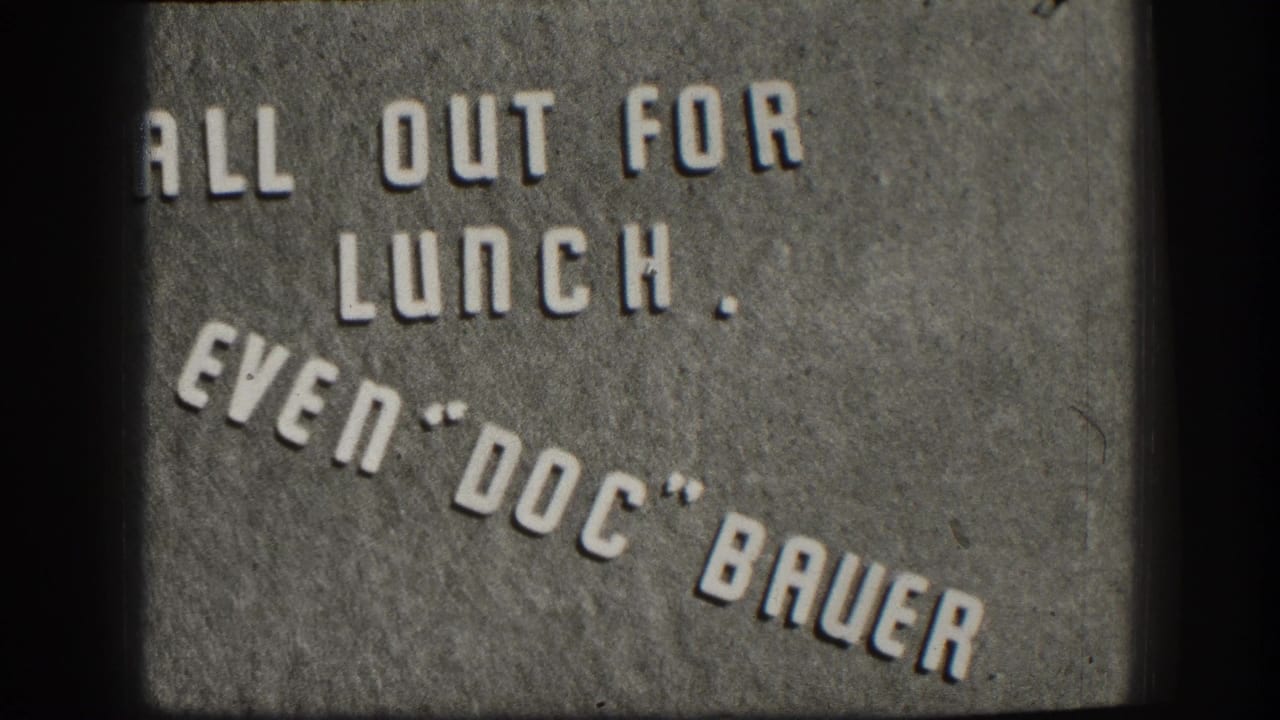 Kansas 1958 home-movie title card with raised letters reading All Out For Lunch, Even Doc Bauer.