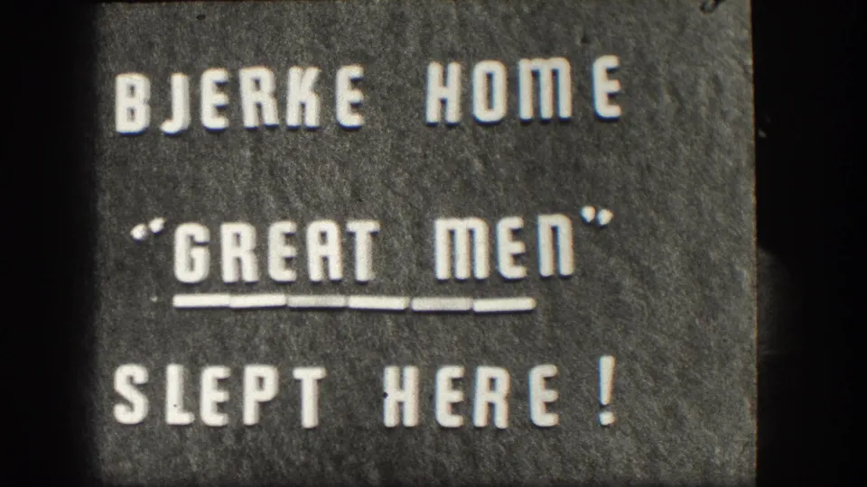 Second 1958 Kansas 8mm title-card frame repeats BJERKE HOME "GREAT MEN" SLEPT HERE! with soft focus and film texture.