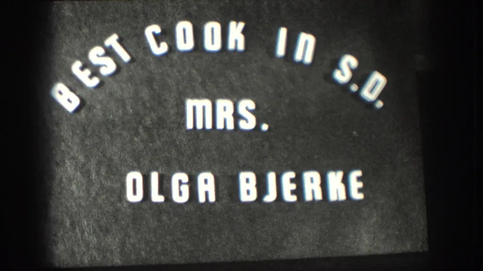 8mm home-movie title card with arched Best Cook in S.D. lettering and the name Olga Bjerke.