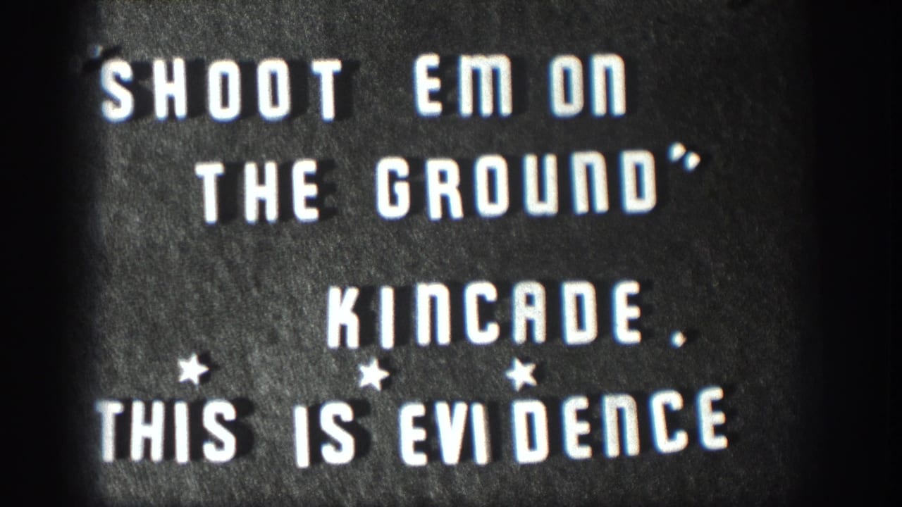 1958 Kansas 8mm title card with white block text on a dark background reading Shoot Em On The Ground and This Is Evidence.