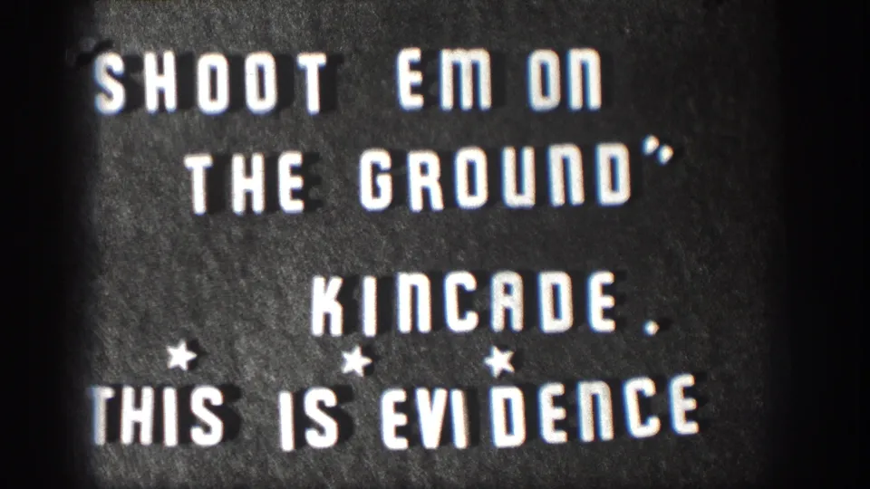 Kansas 1958 home-movie title card showing the phrases Shoot Em On The Ground, Kincade, and This Is Evidence in white letters.