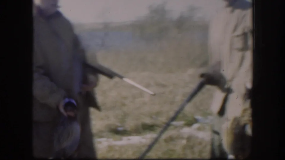 The final frame shows cropped adult hunters in a Kansas field, with shotguns, game birds, grass, and water visible in soft 8mm focus.