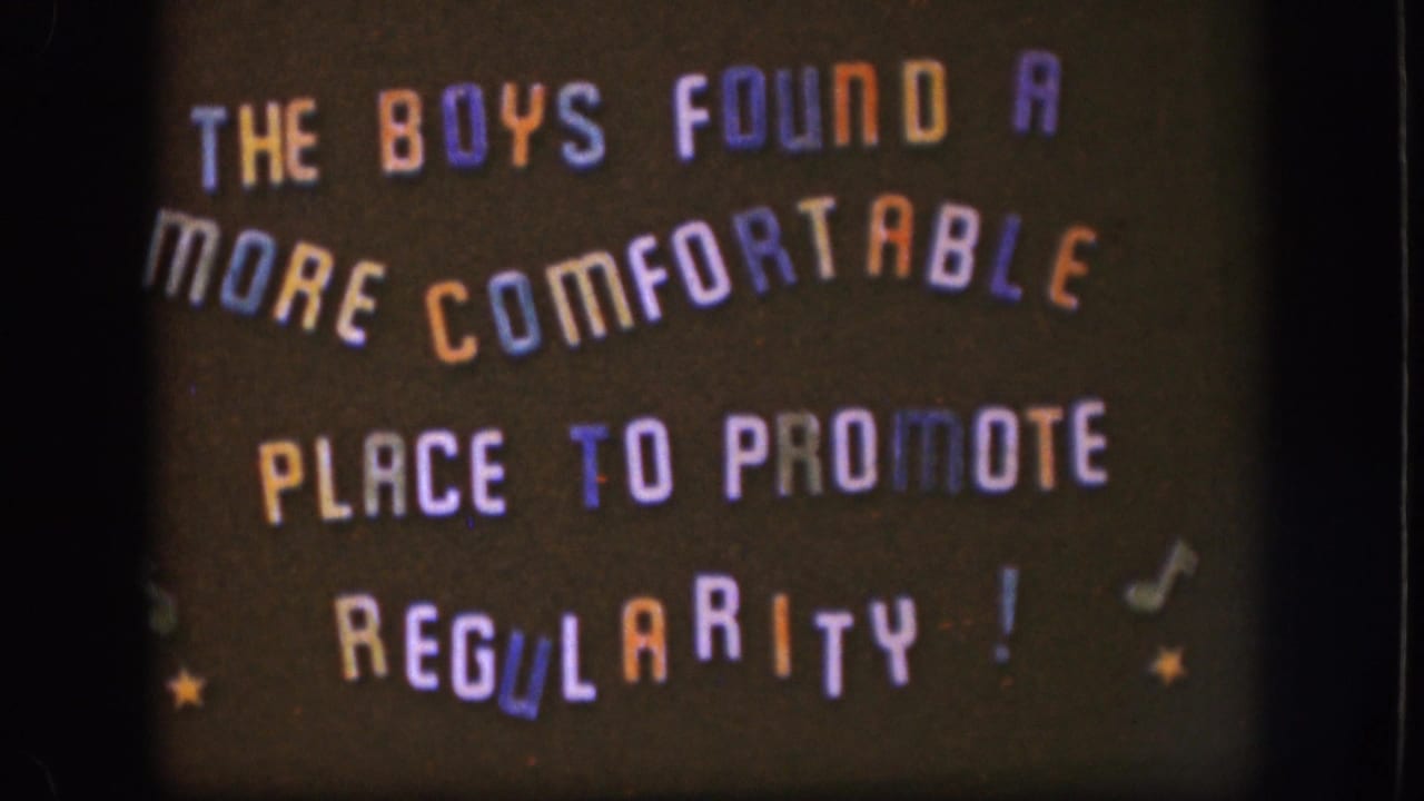 1958 8mm title card with playful multicolored lettering about the boys finding a more comfortable place to promote regularity.