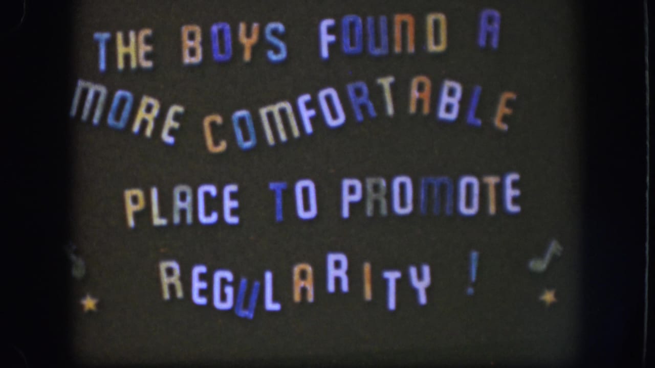 1958 Kansas 8mm still with the humorous regularity message filmed slightly soft and framed by dark film borders.