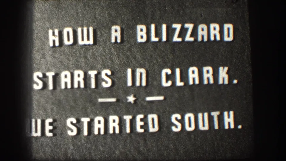 Close 8mm view of the 1958 Kansas title card, with cropped white lettering and a decorative divider on dark stock.