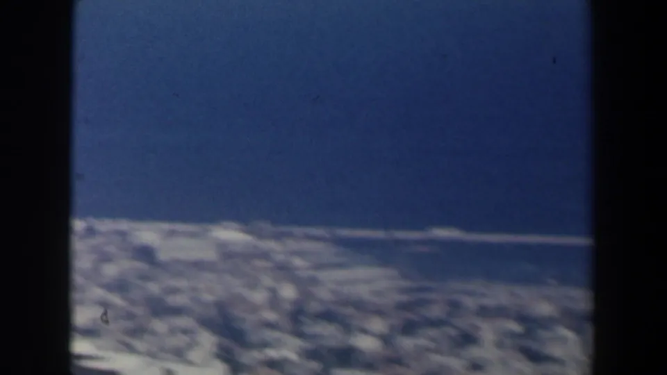 A wide 1960 Israel coastal view shows the blue Mediterranean and a pale cityscape spread along the shoreline beneath the camera.