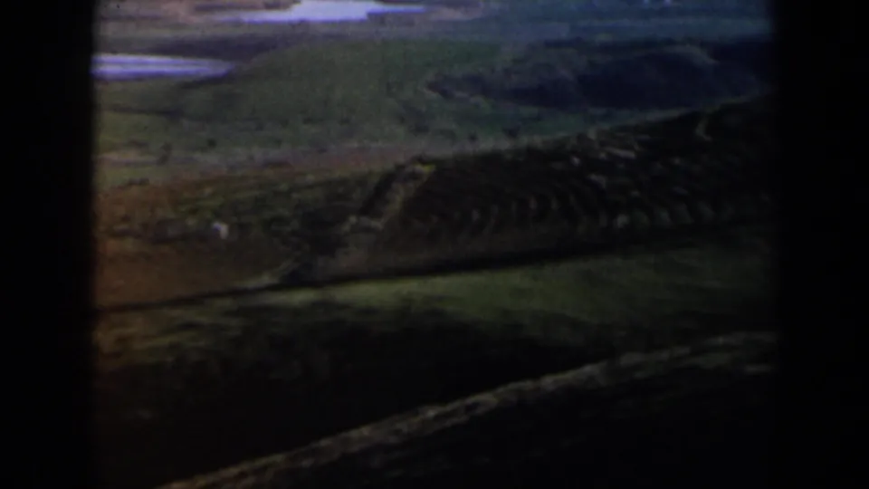 Panoramic 8mm landscape view in Israel, showing hazy hills, fields, and a distant horizon.