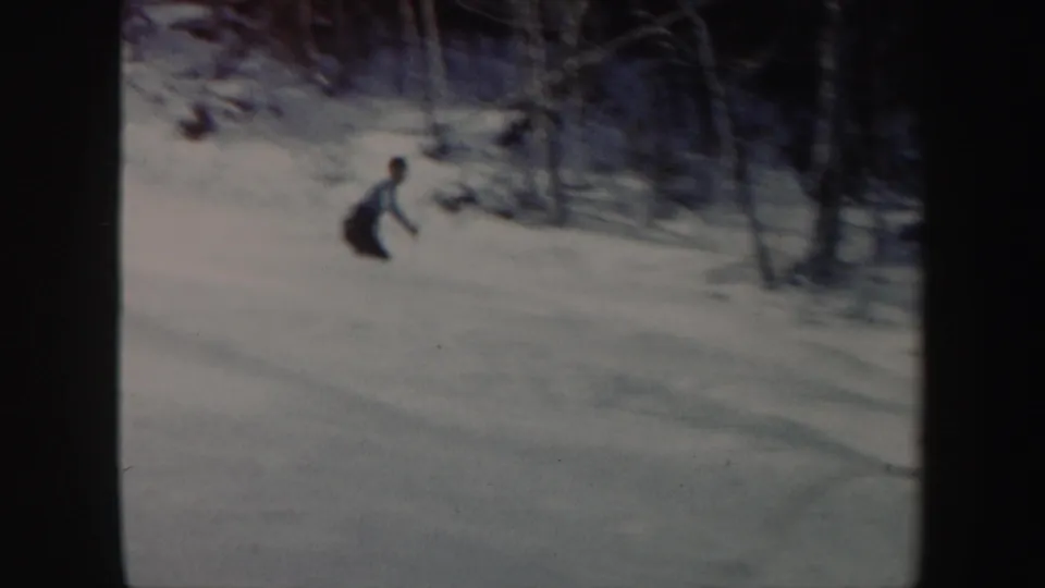 Near the end of the clip, the skier crouches on the snowy Vermont slope with trees close behind the run.