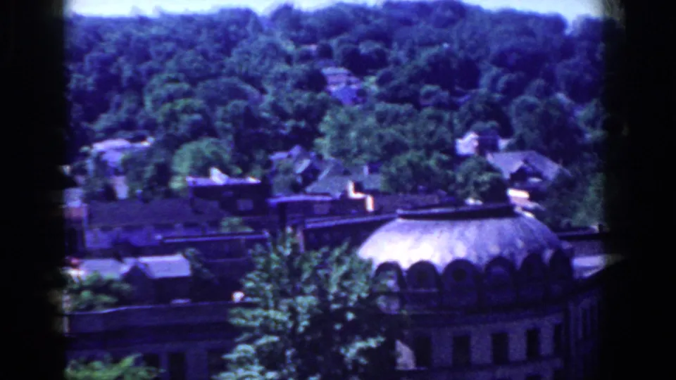 1958 French Lick, Indiana frame with a prominent domed roof below dense green trees.