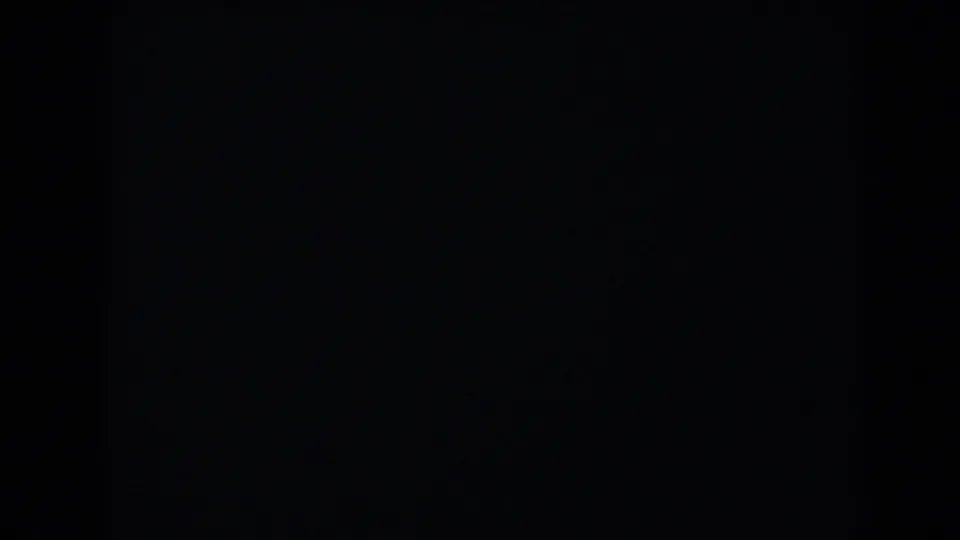 Dark 1958 Las Vegas-labeled 8mm frame with a dim gray upper area and an indistinct vertical shadow.