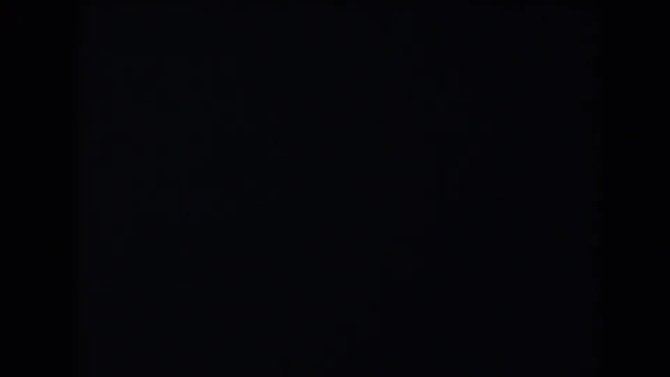 Underexposed 1958 Las Vegas-labeled 8mm frame showing black areas, faint texture, and a central dark division.