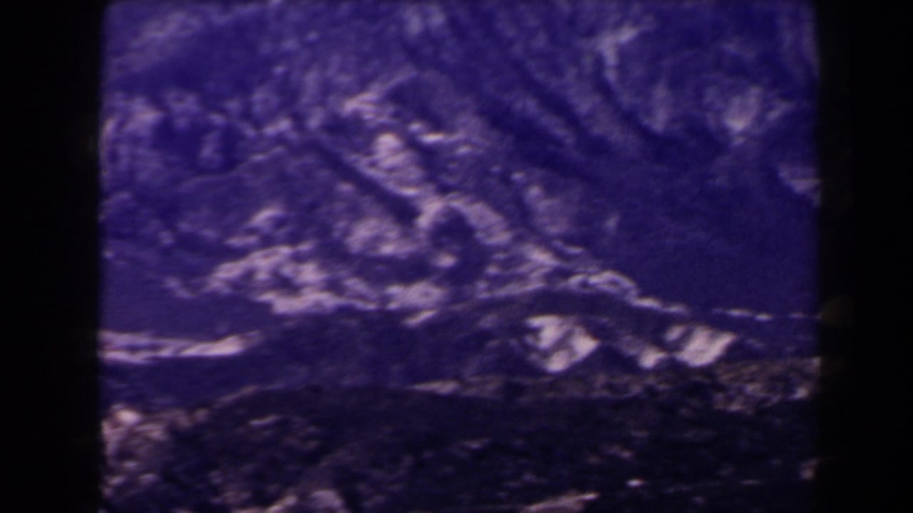 1958 Las Vegas-area 8mm frame showing rugged barren mountain faces during a handheld pan.