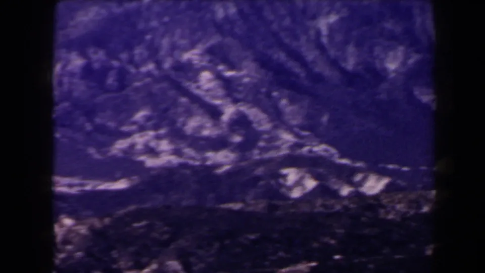 1958 Las Vegas-area 8mm frame showing rugged barren mountain faces during a handheld pan.