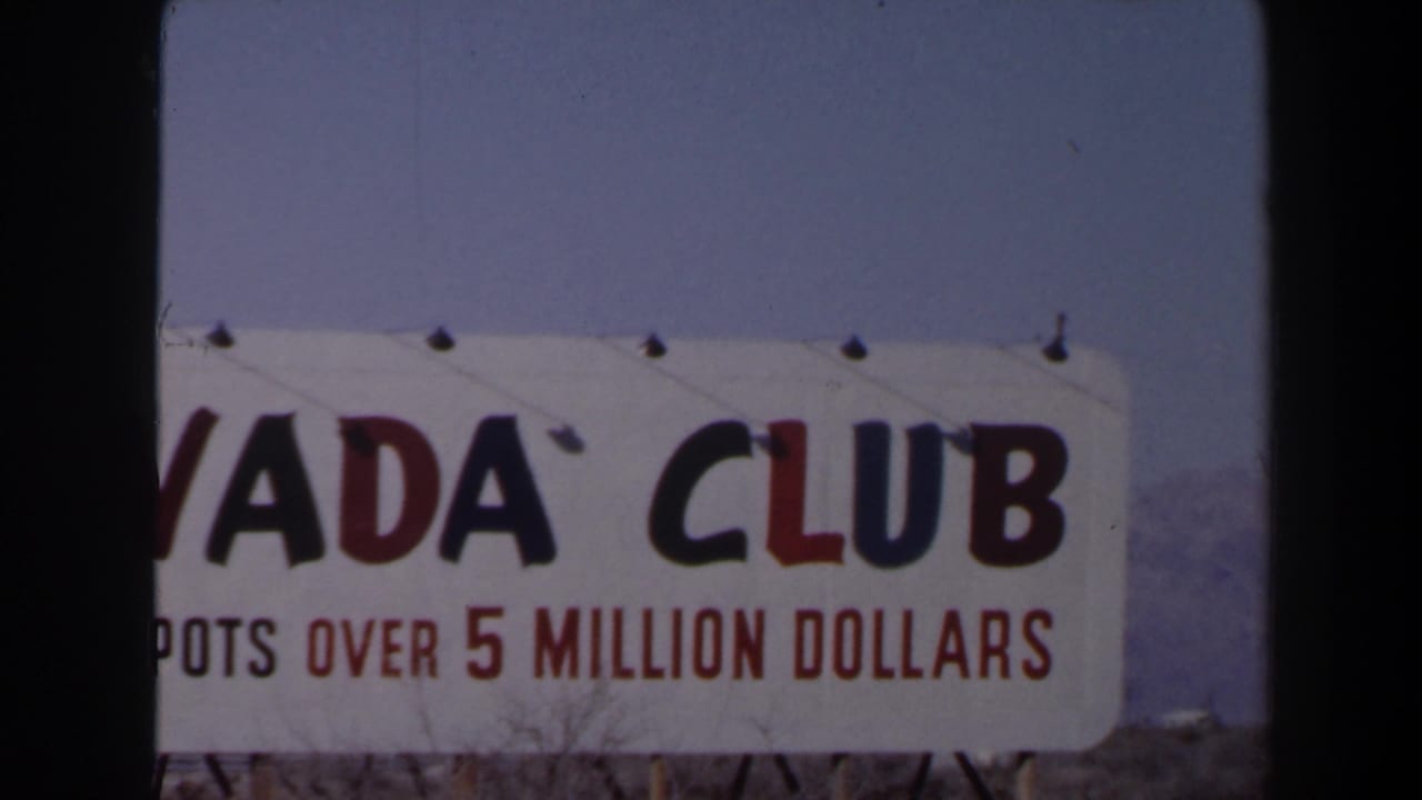 1958 Las Vegas frame with a close, cropped view of the Nevada Club sign and red jackpot lettering.
