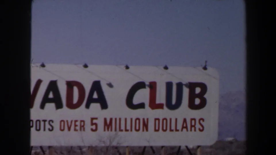 1958 Las Vegas frame with a close, cropped view of the Nevada Club sign and red jackpot lettering.