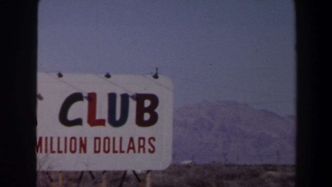 1958 Las Vegas frame with the ADA Club sign cropped to the word “CLUB,” red money-claim text, desert ground, and mountains.