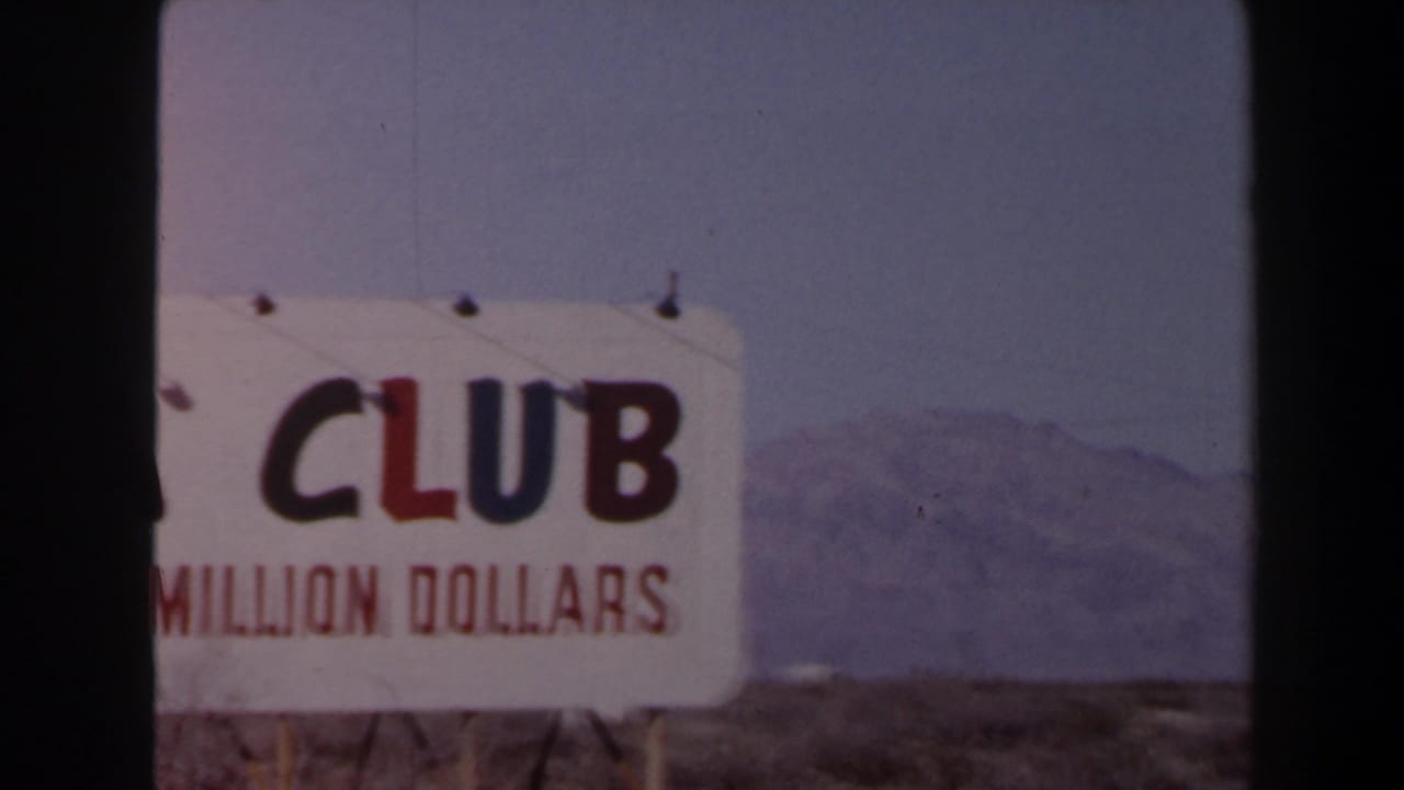 1958 Las Vegas 8mm still of a partially cropped ADA Club roadside sign, with red claim text and a hazy desert mountain background.
