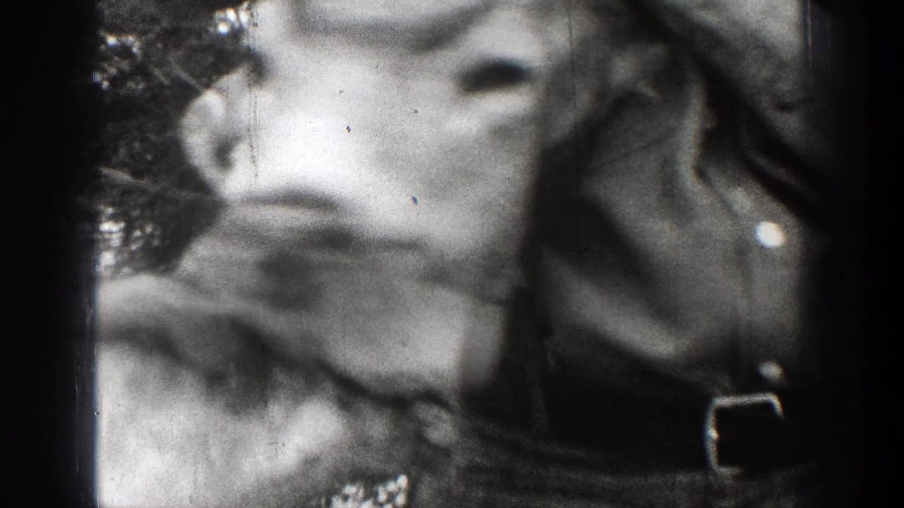 Close, blurred view of a deer skull with antlers near a person's torso.