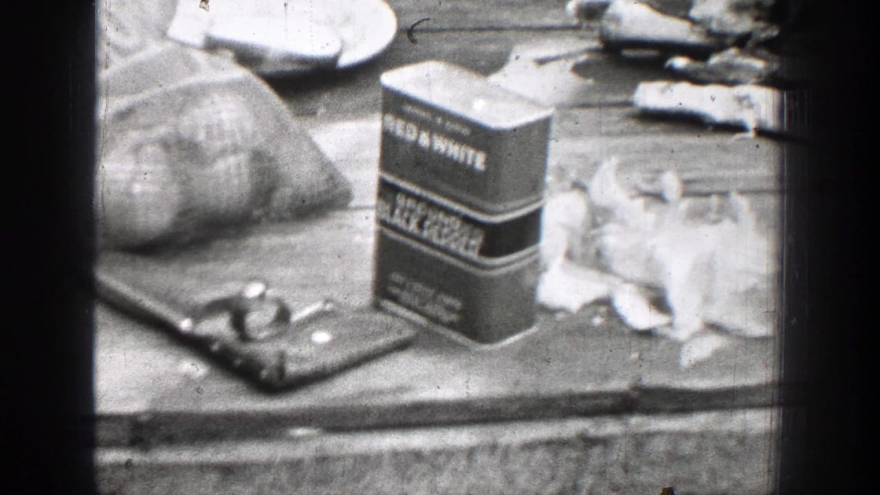 Branded seasoning tins, cloth bags, and food scraps sit on a wooden surface.