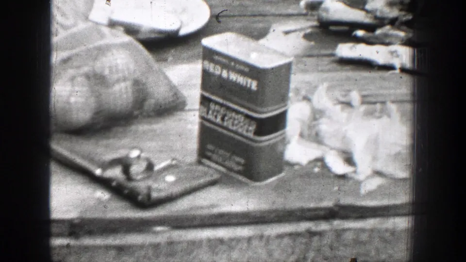 Red & White branded seasoning packaging and food preparation items sit on an outdoor wooden work surface in Chelan, Washington footage.
