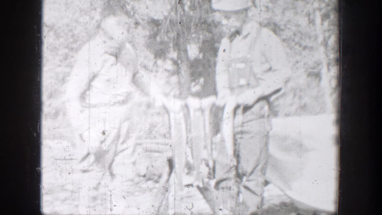 Two fishermen appear in a bright, soft 8mm frame, holding fish in a wooded Chelan-area outdoor setting.