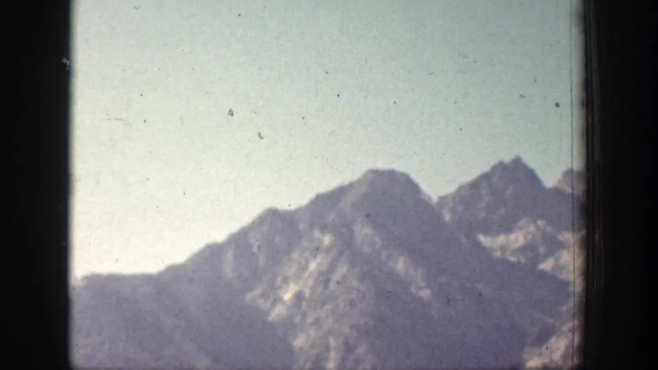 1939 Chelan, Washington 8mm view of hazy mountain ridges, softened by exposure, grain, and distance.