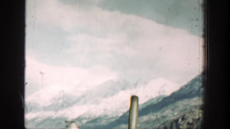 The final frame shows Chelan-area snow-covered mountains and valley slopes through a vehicle window.
