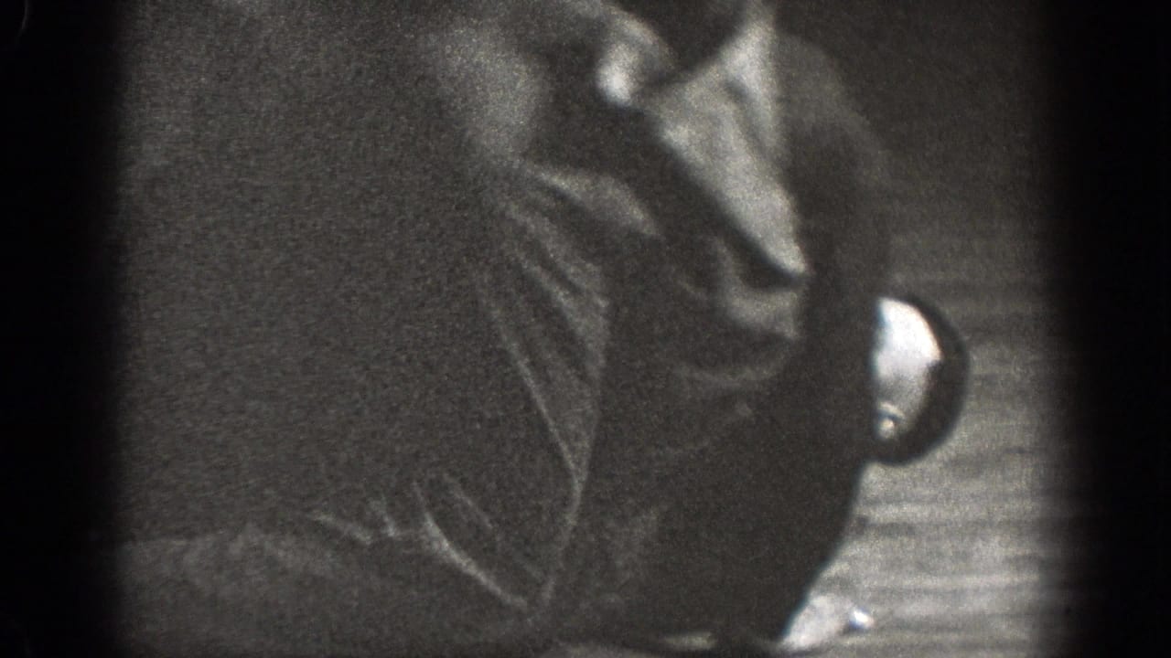 A person lies or rolls on the floor during a grappling exercise.