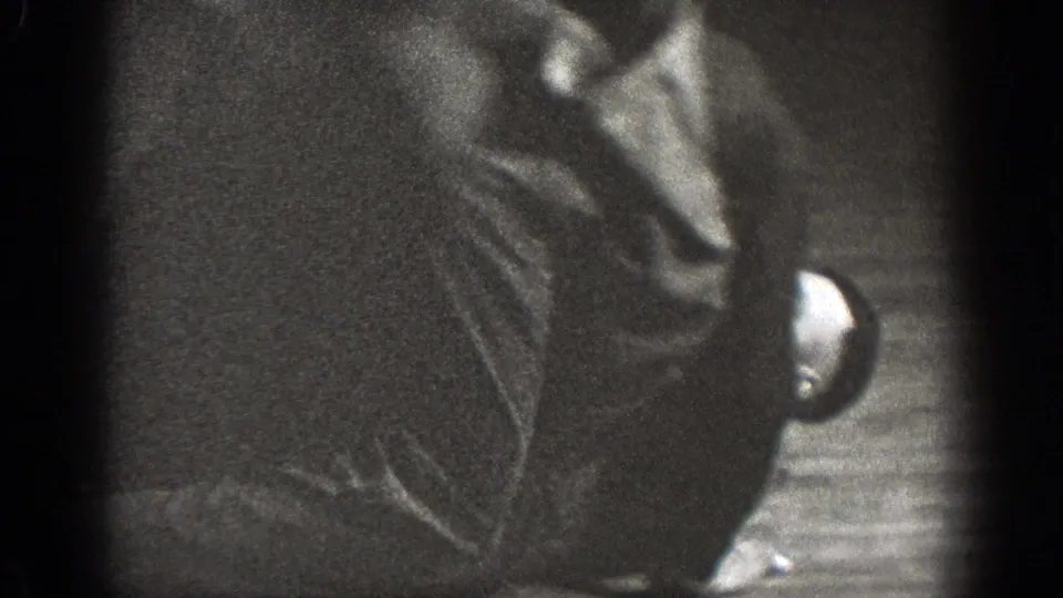 Chelan, Washington 1939 frame with a participant turned on the floor during judo or grappling practice.