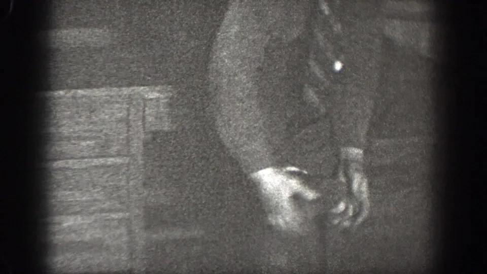 The 1939 Chelan footage shows a shirted man leaning down indoors as he appears to put on a sock.