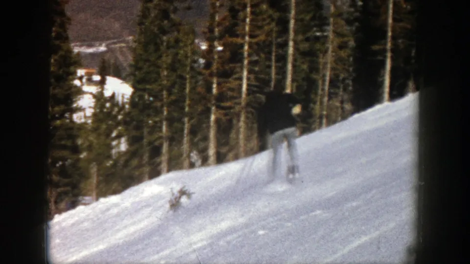 Final frame shows the Aspen skier lower on the slope, with dense evergreens and snow-covered terrain around him.