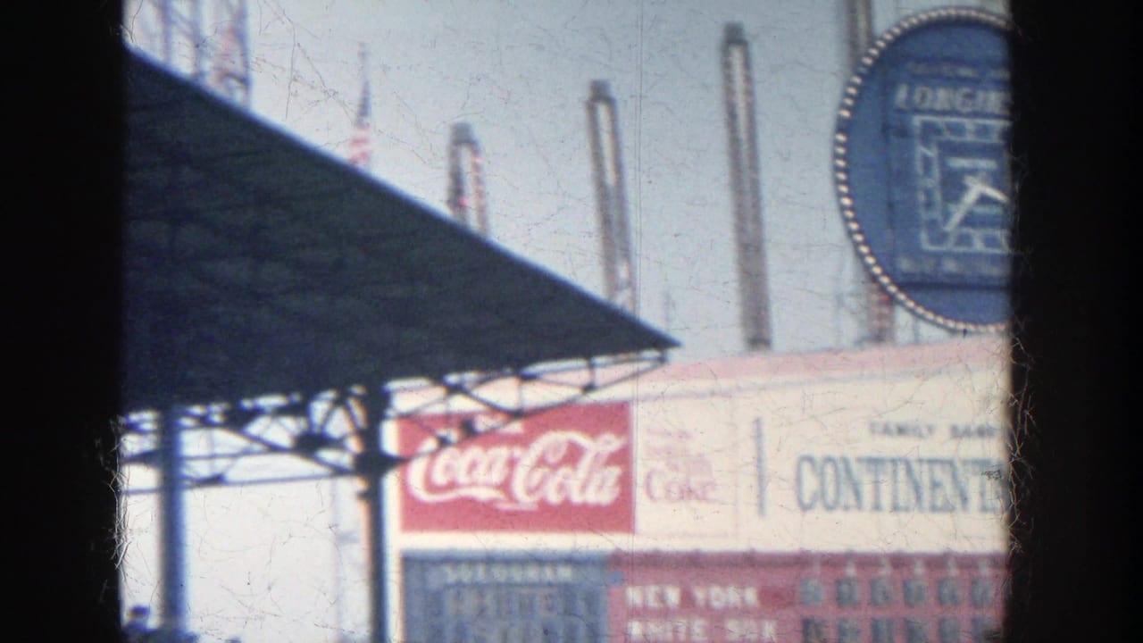 1964 Yankee Stadium scoreboard detail with Longines clock partly at right and Coca-Cola and Continental Bank signage below.