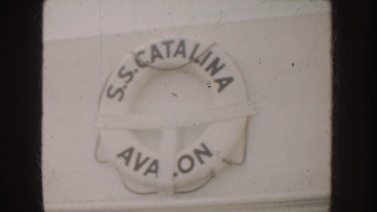 1952 California 8mm frame showing a white S.S. Catalina life preserver with partial Avalon lettering and soft film texture.