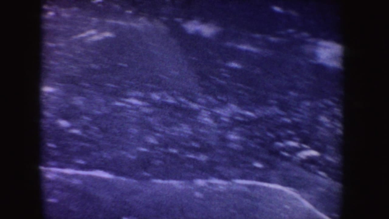 Icy outdoor surface with a pale line crossing the lower frame.