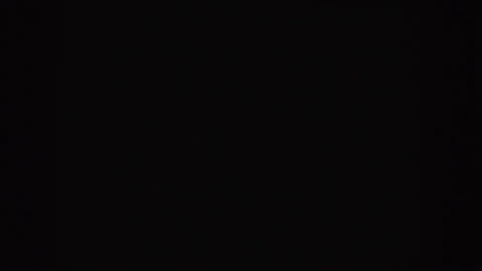 Final dark 8mm frame from the 1955 Idaho start-screen clip, with only faint grain visible.