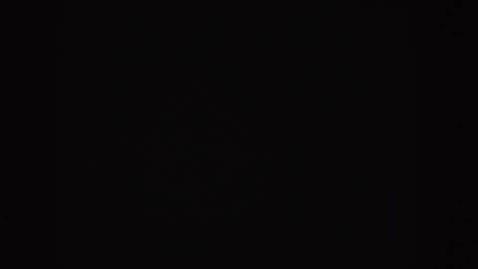 Nearly black 1955 Idaho 8mm home-movie start frame with faint grain and no identifiable subjects or setting.